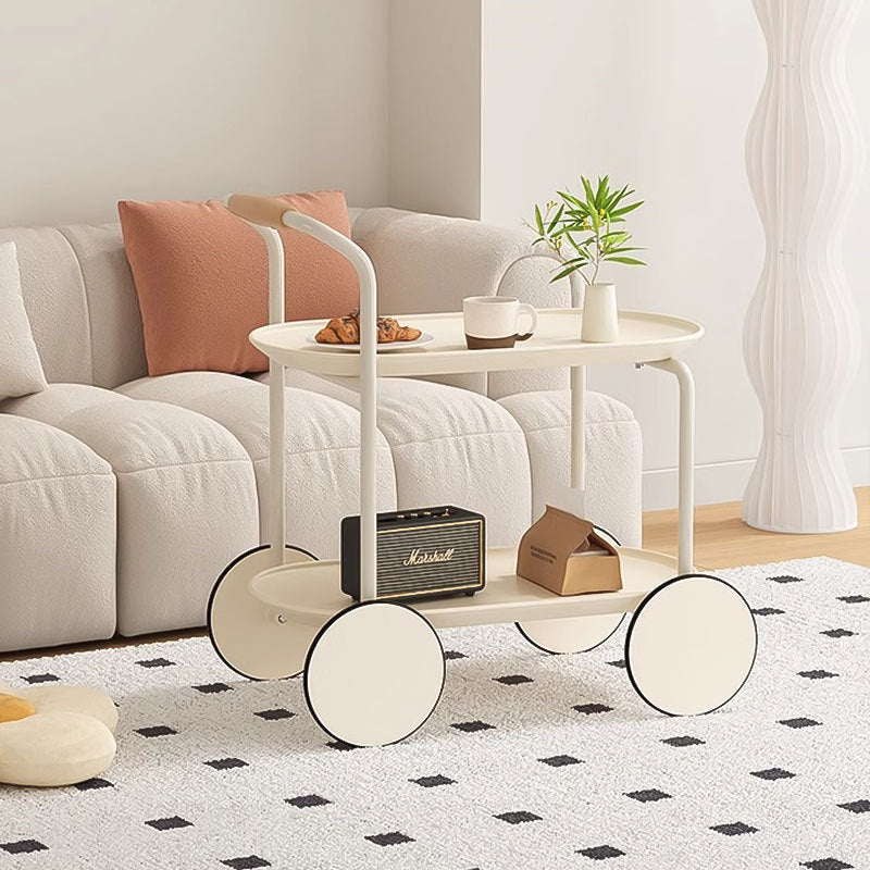 Modern minimalist living room with a rolling trolley holding coffee and decor items, placed near a sofa. Ideal for versatile home use, highlighting ease of movement and direct wholesale from China.