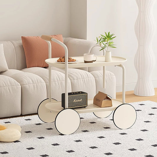 Modern minimalist living room with a rolling trolley holding coffee and decor items, placed near a sofa. Ideal for versatile home use, highlighting ease of movement and direct wholesale from China.