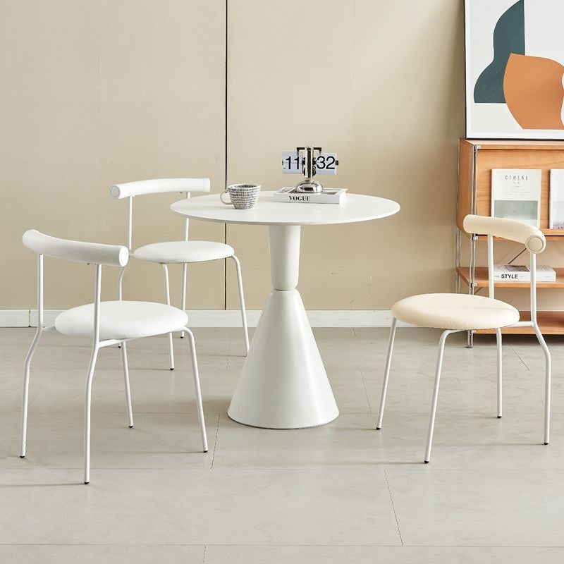 Round dining table with minimalist design and three sleek chairs, including one with a mesh backrest and one with padded seating. Ideal for dining rooms, cafés, or offices. Suitable for bulk purchasing from a leading Chinese furniture manufacturer with customizable options.