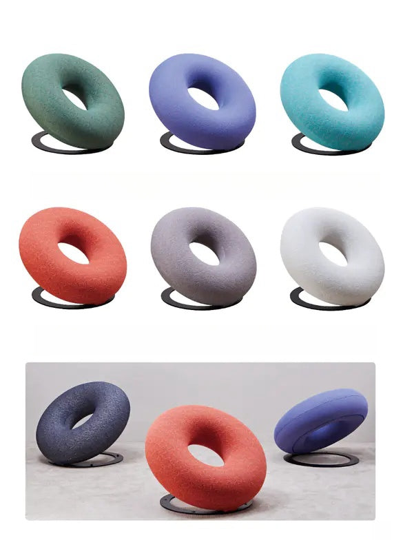 Modern donut-shaped lounge chairs, ideal for residential and commercial interiors, available for wholesale from a leading Chinese manufacturer. Versatile seating for living rooms, offices, and hospitality spaces.