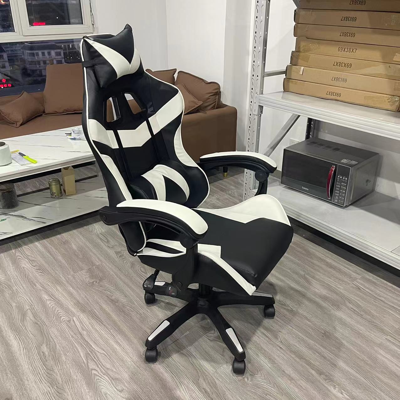 Ergonomic racing-style office and gaming chair with headrest and lumbar support, adjustable height, reclining function, and 360° swivel base. Versatile for office setups, gaming stations, or bulk purchases from Chinese suppliers.