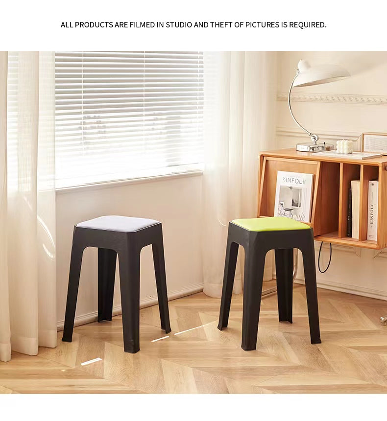 Two stackable stools next to a window in a modern living room setting, ideal for cafes, offices, or small homes. Suitable for wholesale buyers directly sourcing from Chinese manufacturers.