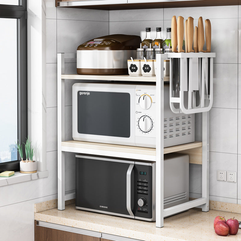 Multi-functional kitchen shelving unit holding kitchen appliances such as microwave, rice cooker, condiments, and utensils, ideal for home kitchens and restaurants, offering space-saving organization and available for direct wholesale from China.