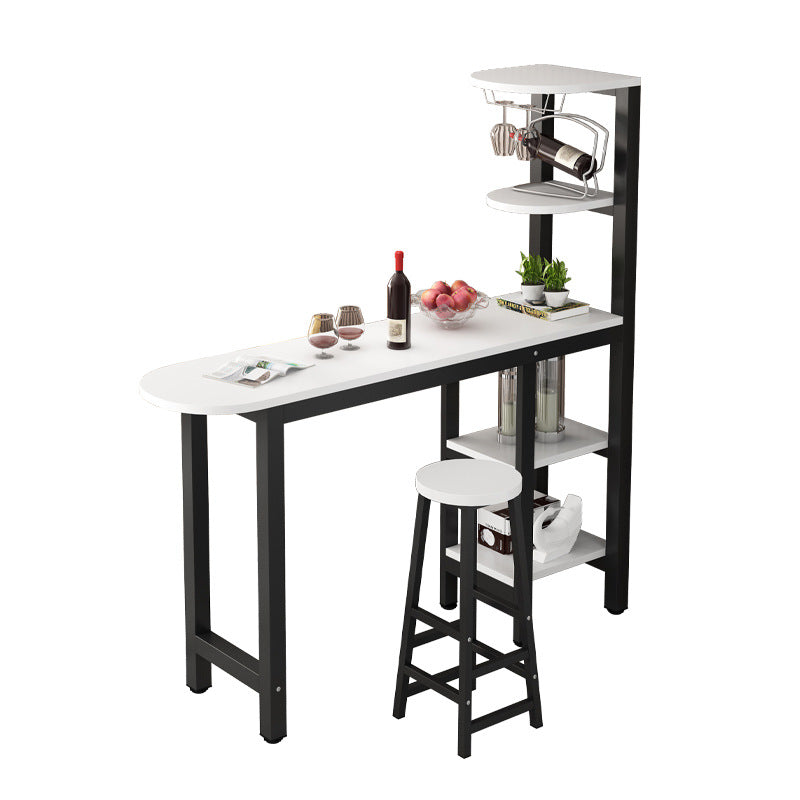 Compact bar table with built-in shelving and two stools (one upholstered, one mesh) for dining or casual seating. Ideal for small spaces at home or in kitchens. Wholesale direct from a leading Chinese furniture manufacturer.