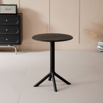 Compact round coffee table in a modern indoor setting, ideal for cafés, offices, and patios. Perfect choice for buyers looking to wholesale furniture directly from China.