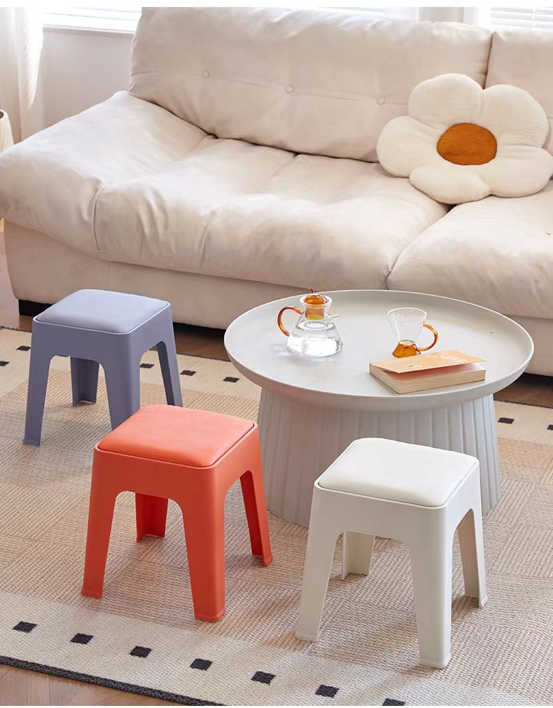 Multipurpose stools in a living room setting, suitable for homes or commercial spaces. Ideal for wholesale purchases directly from a Chinese manufacturer. Stackable and space-saving stools for flexible use.