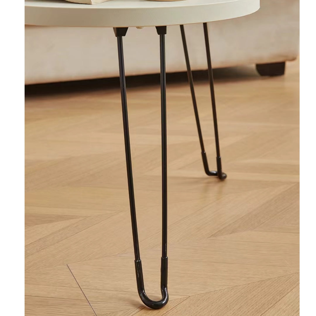 Foldable round coffee table detail shown in modern living room setting, ideal for wholesale from Chinese manufacturer.