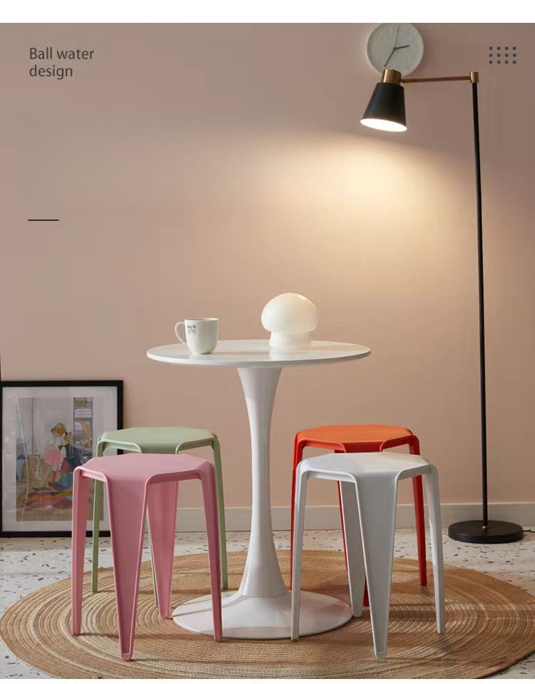 Modern stackable stools and side table set in a home or office lounge setting, ideal for versatile use and bulk purchasing directly from a China-based manufacturer.