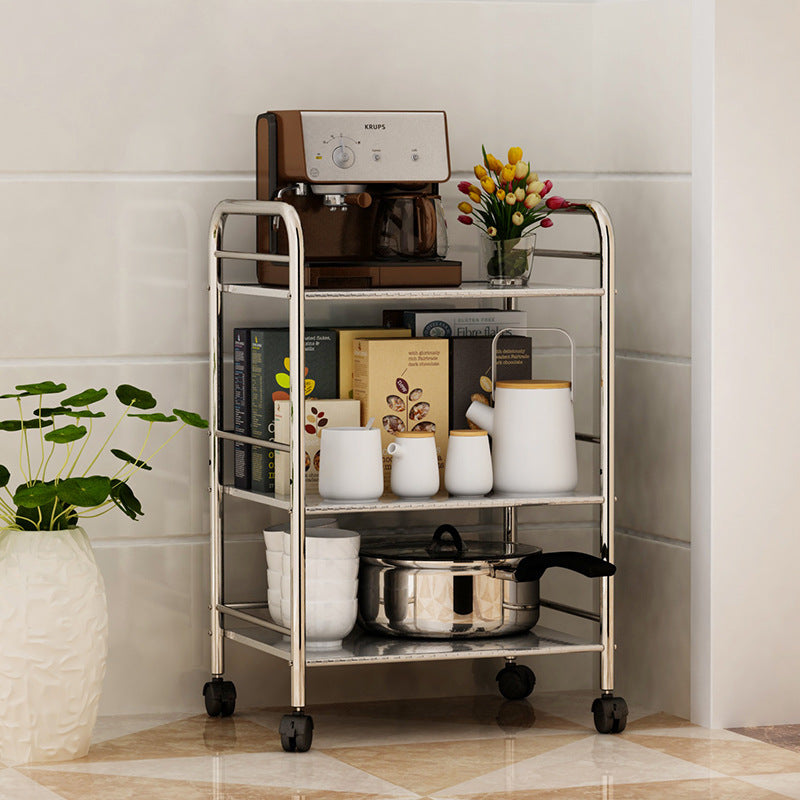 Rolling kitchen storage cart with wheels holding a coffee machine, books, cookware, jars, and decorative items, ideal for home or office organization with easy mobility. Suitable for bulk orders directly from Chinese suppliers.