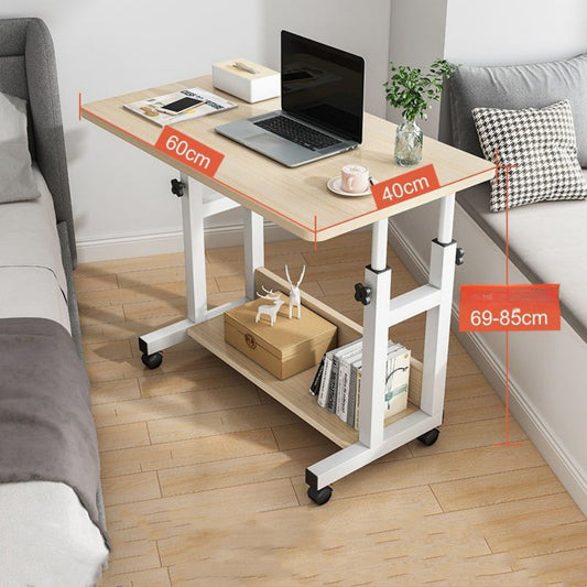 Adjustable height mobile desk with casters used as a laptop workstation or side table in a home office setting, highlighting versatility for sitting or standing use. Ideal for bulk sourcing directly from manufacturers in China.