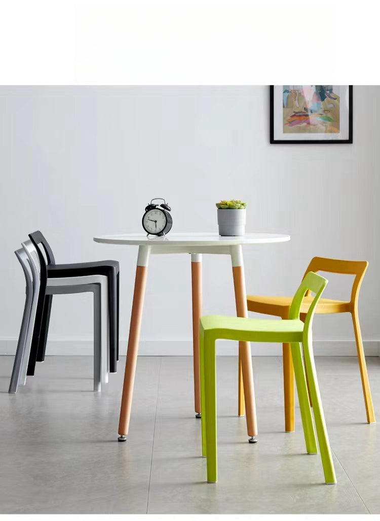 Modern dining and café chairs around a round table, suitable for restaurants, cafes, and office spaces. Ideal for wholesale directly from China.