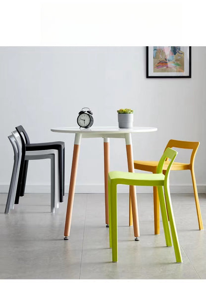 Modern dining and café chairs around a round table, suitable for restaurants, cafes, and office spaces. Ideal for wholesale directly from China.