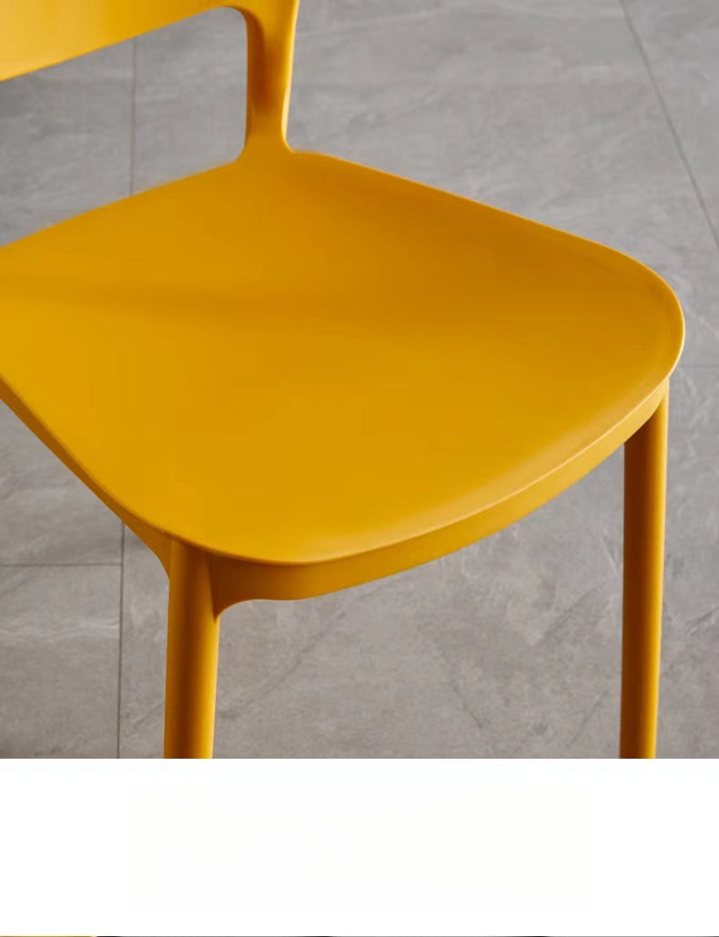 Minimalist stackable chair suitable for dining areas, cafes, and offices, ideal for bulk purchasing from a China-based manufacturer.