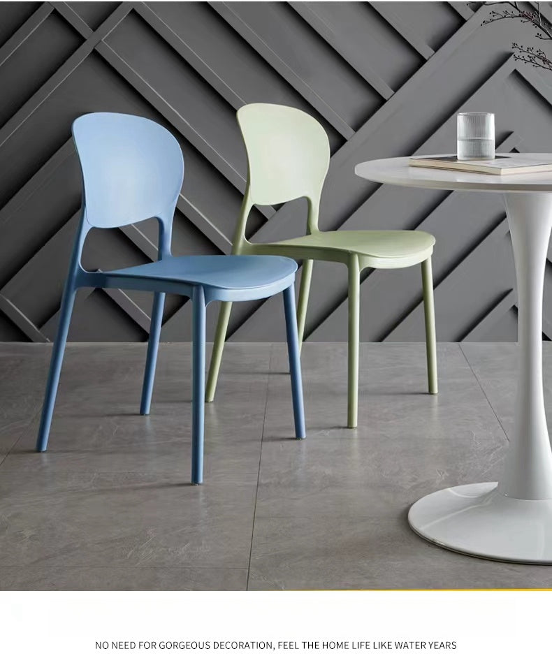 Modern minimalist stackable dining chairs suitable for cafés, dining rooms, and offices; available for bulk orders directly from a China-based manufacturer.