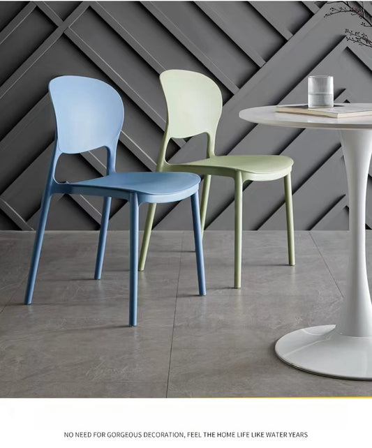 Modern minimalist stackable dining chairs suitable for cafés, dining rooms, and offices; available for bulk orders directly from a China-based manufacturer.