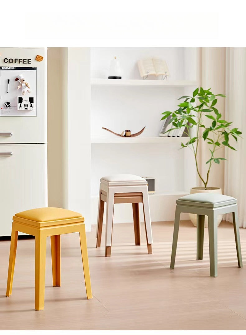 Stackable modern stools in a living space, ideal for dining rooms, kitchens, or commercial use; available for bulk wholesale directly from a Chinese supplier.