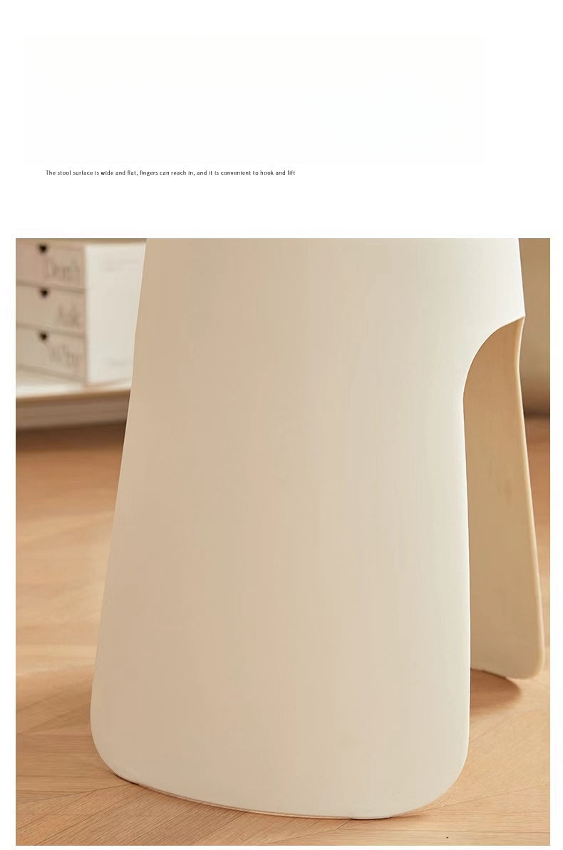 Close-up of a minimalist multifunctional stool, highlighting its sleek design and easy-to-grip surface for effortless mobility; fits well in modern spaces and offers a practical seating solution, ideal for wholesale buyers seeking furniture from China.