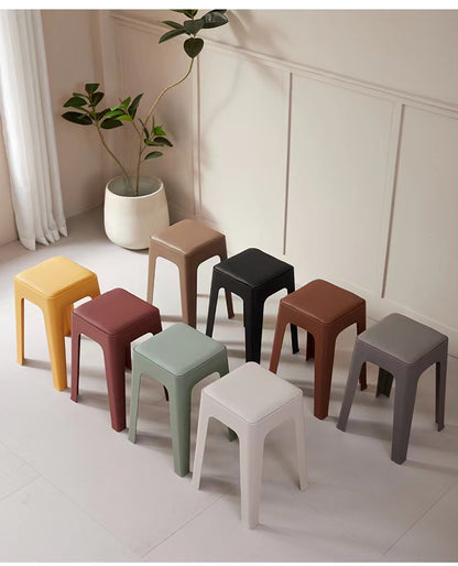 Stackable minimalist stools in neutral-toned modern space, ideal for wholesale orders from China for cafes, restaurants, offices, and home interiors, with ergonomic design for comfort and easy storage.