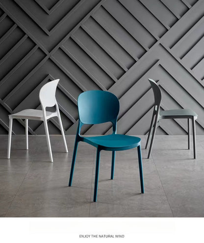 Stackable minimalist dining chairs suitable for modern cafes, dining rooms, and commercial spaces, available for bulk orders directly from a China-based manufacturer.