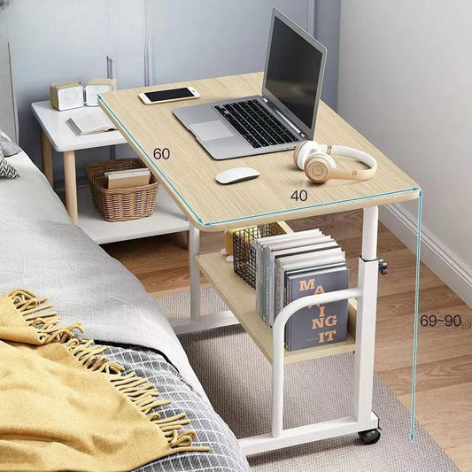 Adjustable mobile desk with wheels beside bed, featuring convenient lower shelf for storage. Ideal for use in bedrooms, home offices, or living rooms. Suitable for wholesale furniture orders directly from Chinese manufacturers.