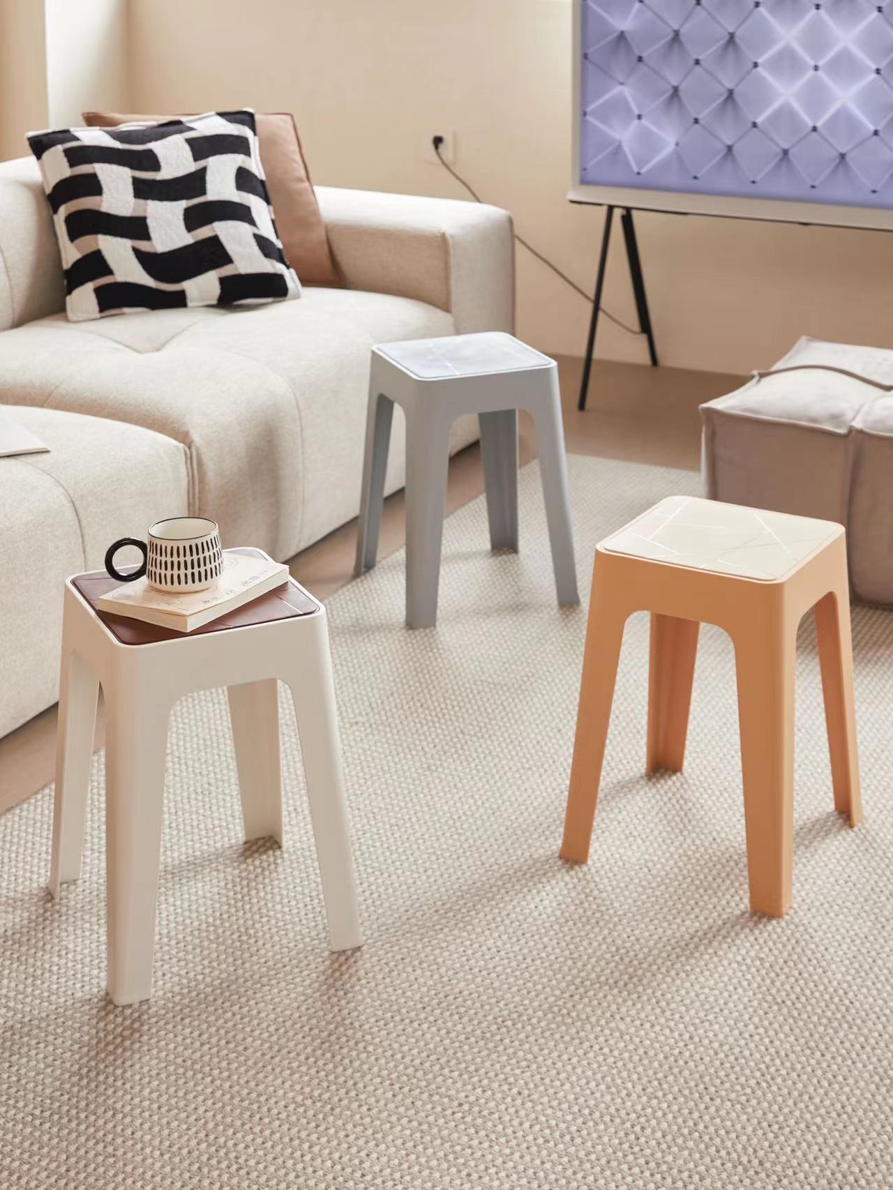 Stackable stools ideal for living rooms and commercial spaces, offering space-saving solutions for wholesale buyers from a Chinese manufacturer.