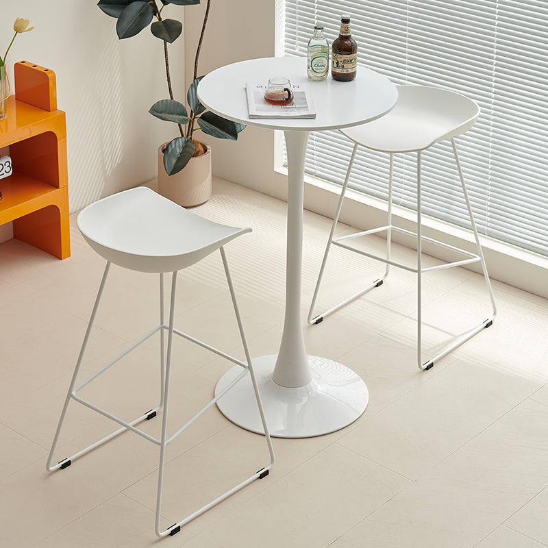 Modern bar table with two stools in a minimalist dining setup, ideal for home bars, cafés, and flexible commercial spaces. Perfect for wholesale buyers looking for stylish and functional furniture directly from a trusted Chinese manufacturer.