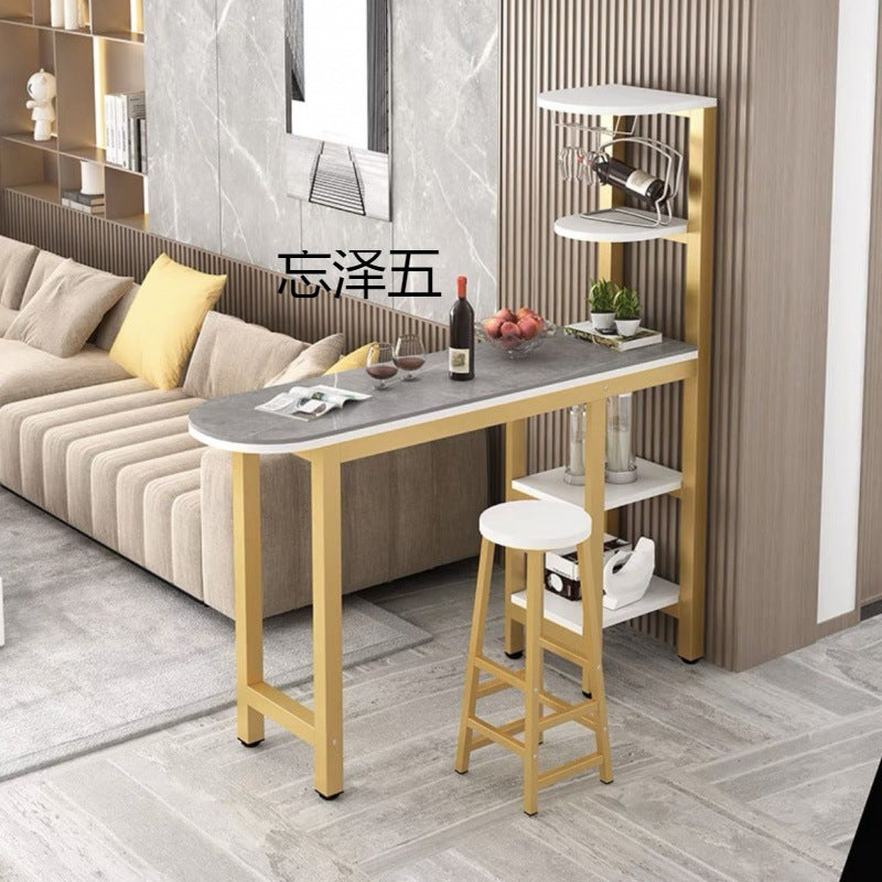 Compact bar table set with integrated shelving and seating, including a round leather chair. Ideal for small spaces such as kitchens or living rooms. Wholesale from China for competitive pricing.