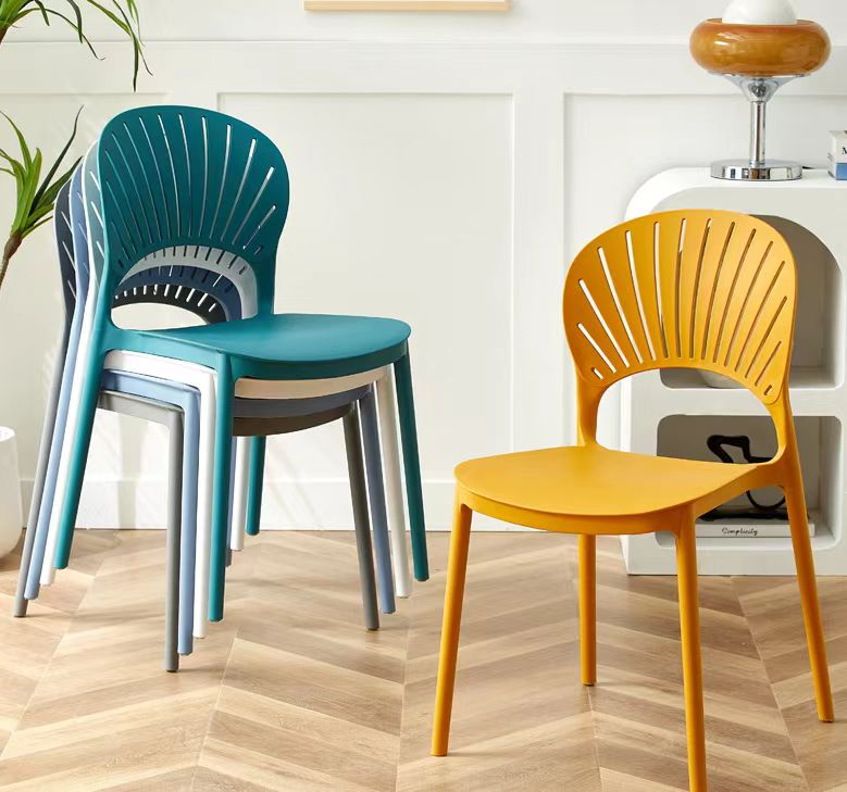 Stackable ergonomic chairs suitable for dining areas, cafes, and patios; ideal for wholesale buyers seeking durable furniture from a reliable China-based supplier.