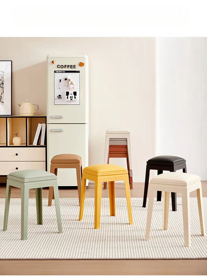 Stackable modern stools arranged in a living room space, suitable for dining areas, kitchens, and commercial settings, available for bulk wholesale directly from China.