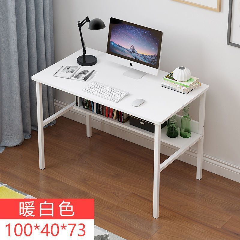 Office desk setup with computer, keyboard, lamp, and books, suitable for home offices or study areas. Ideal for bulk buyers looking for wholesale pricing from China.