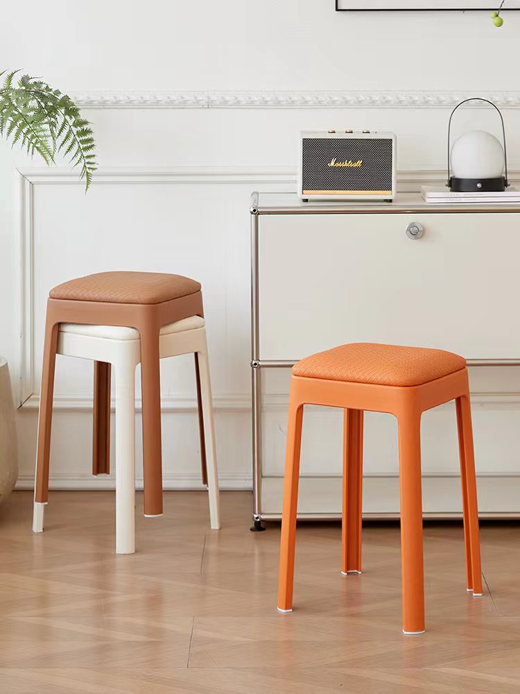 Stackable stools designed for versatile use in dining and office spaces, offering easy storage and mobility. Ideal for bulk wholesale orders from a Chinese manufacturer. Suitable for modern cafes, offices, and collaborative work areas.