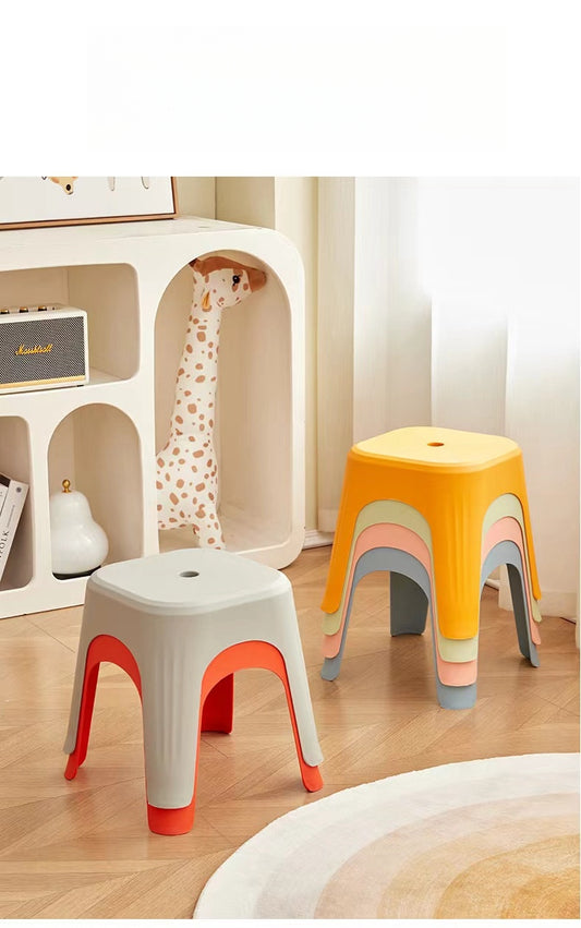 Stackable stools in a minimalist setting, ideal for living rooms and lounges. Easy to store, perfect for wholesale buyers sourcing furniture from China.