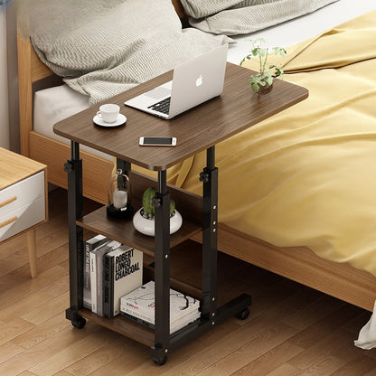 Adjustable mobile laptop desk used as a convenient side table in a bedroom setup, showcasing its multi-level storage features. Ideal for remote work or personal use, with wholesale options directly from China.