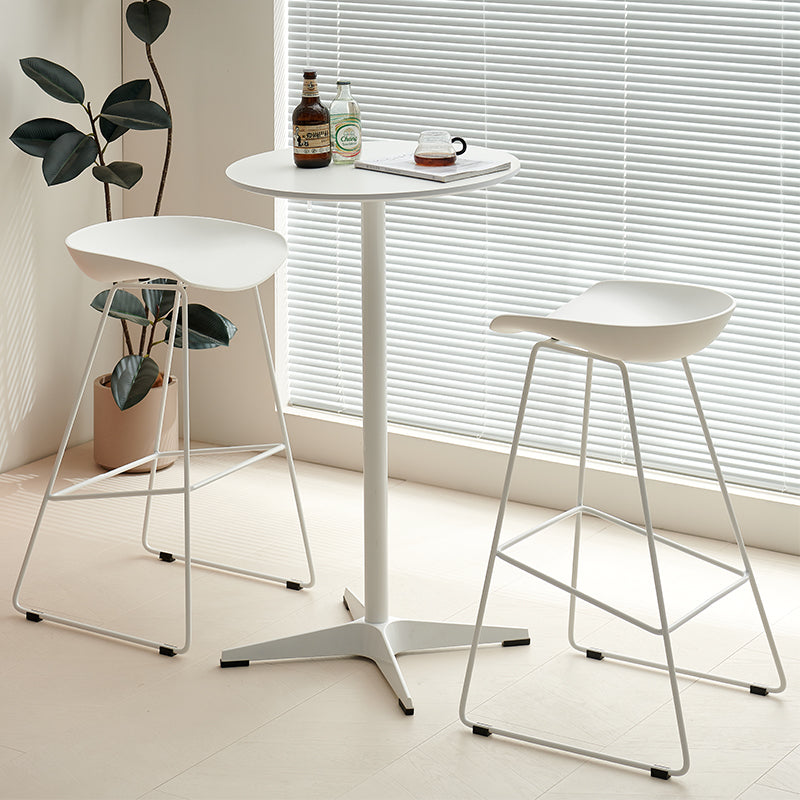 Round bar height café table with two modern bar stools, perfect for restaurants, bars, and lounges. Ideal for wholesale buyers from Chinese manufacturers, offering space-saving, functional furniture for commercial and residential use.