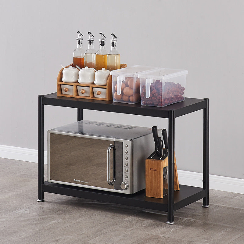 Multi-functional storage rack used for organizing kitchenware, including a microwave, spices, and utensils. Ideal for enhancing space in kitchens or living rooms. Designed for wholesale buyers sourcing directly from China.