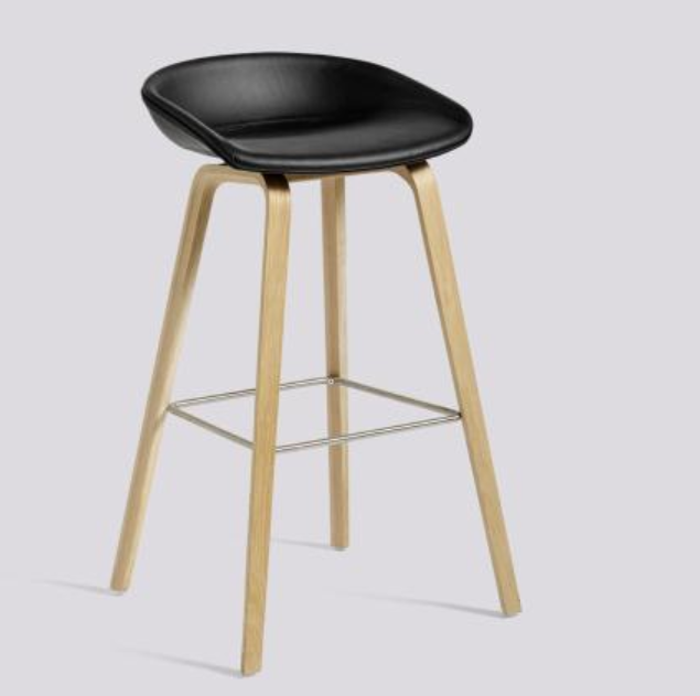 Leather bar stool with low backrest, sleek design for bars, cafes, kitchen counters, and commercial spaces, available for bulk order from Chinese manufacturers at wholesale prices.