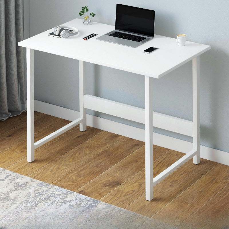 Simple workstation desk with a laptop, headphones, and accessories, suitable for home offices, study spaces, or business settings. Ideal for wholesalers and bulk sourcing from a Chinese manufacturer.