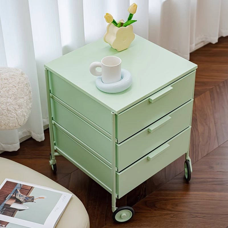 Three-drawer mobile storage cabinet on wheels, perfect for use as a bedside table, office storage, or living room organizer. Convenient design for flexible room arrangements and easy reorganization. Ideal for wholesale purchase directly from China.