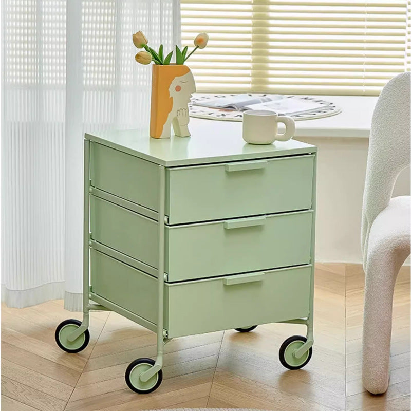 Rolling storage cabinet with three drawers, smooth wheels for easy mobility, ideal for bedroom or living room use. Perfect for organizing items or serving as a bedside table. Suitable for wholesale direct from China.